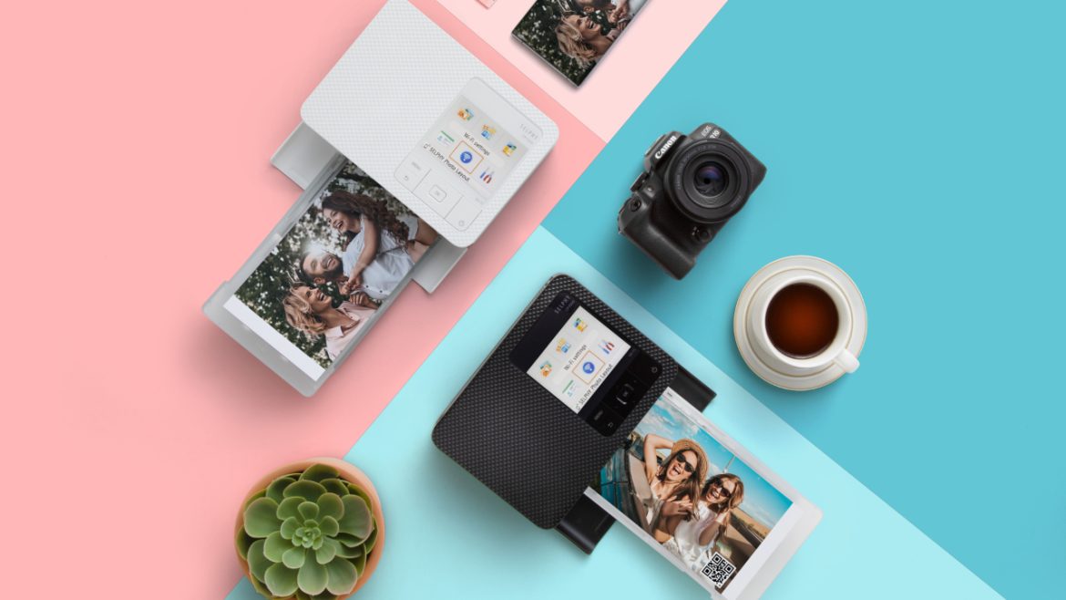 flatlay photo of canon selphy cp1500 photo printers