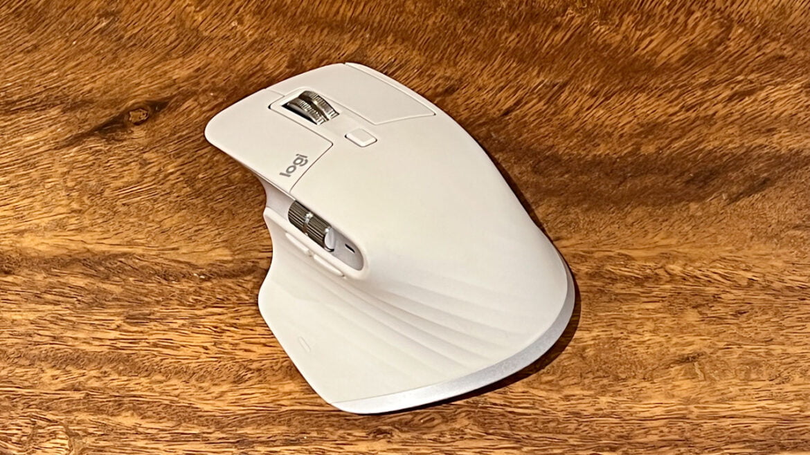 image of pale grey logitech mx master 3s on wooden table