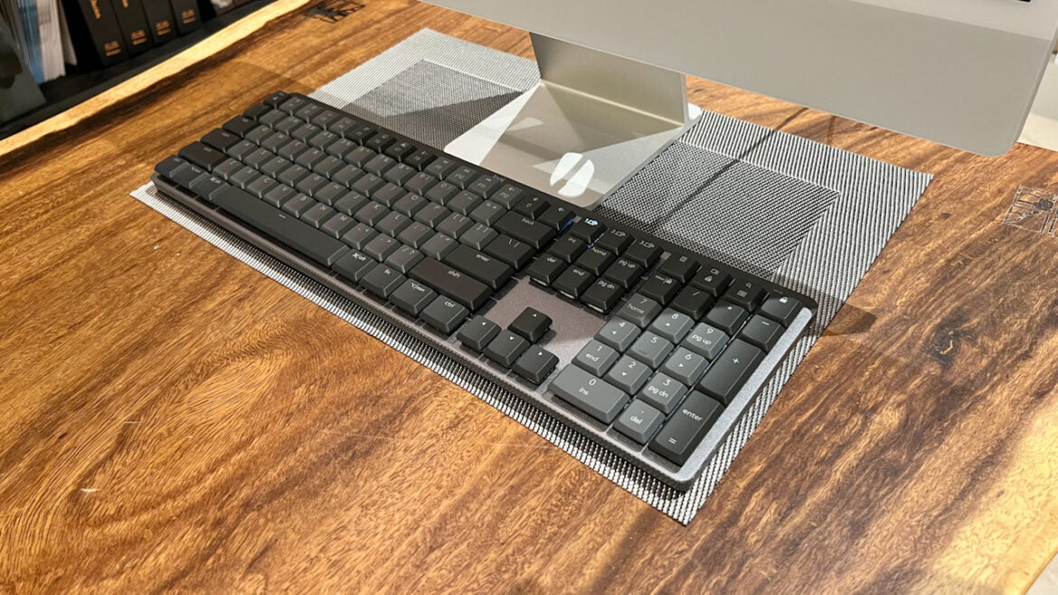 F581B952-2040-44F4-A479-C45D619DBB8E Logitech MX Mechanical in front of a monitor