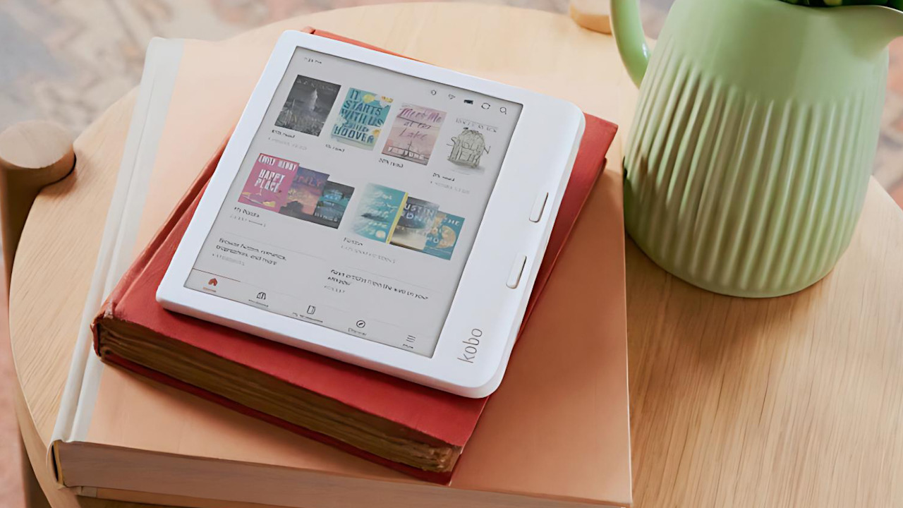 Kobo Libra Colour e-reader on a stack of books