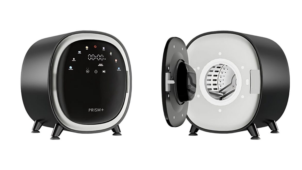 Space-grey PRISM+ Spin Mini washer-dryer shown front-on with the door closed and open, revealing its stainless-steel drum.